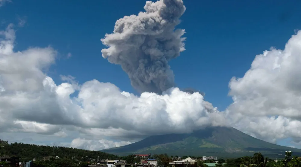 Smoke billows into the sky as Mayon volcano erupts as seen from Legaspi City, Albay province, south of Manila on October 30, 2026. (AFP)