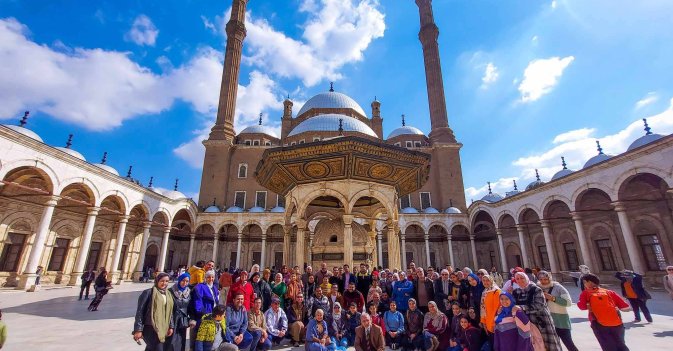 A group of young people exploring a ​historic neighborhood