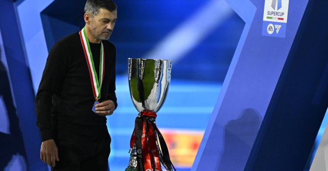 Sergio Conceicao celebrates with the Super Cup trophy