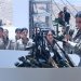 مقاتلات من حزب العمال الكردستاني في أثناء تسليم أسلحتهن في السليمانية (أ.ف.ب)
