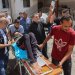 فلسطينيون ينقلون جريحاً أُصيب في غارة إسرائيلية على كنيسة العائلة المقدسة بغزة الخميس (أ.ف.ب)