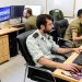خبراء تكنولوجيا يعملون في وحدة بيانات وتطبيقات العمليات بالجيش الإسرائيلي (رويترز)