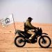 عنصر من «الحشد الشعبي» على دراجة نارية في دورية غرب البلاد (موقع الهيئة)