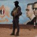 صورة للرئيس السوري المخلوع بشار الأسد في مقر الفرقة الرابعة بدمشق (أرشيفية- رويترز)