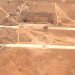 صورة التقطها قمر اصطناعي تُظهِر حفراً على مدارج قاعدة أبو الظهور الجوية قرب حلب السورية بعد هجوم إسرائيلي (رويترز)