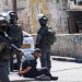 القوات الإسرائيلية تعتقل فلسطينياً خلال مداهمة مركز تابع لـ«الأونروا» جنوب رام الله بالضفة الغربية يوم الثلاثاء (أ.ف.ب)