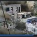لقطات كاميرات المراقبة تُظهر أشخاصاً يفرون هاربين بينما يدمر جدار من الطين والماء المباني في وادٍ على الحدود النيبالية الصينية في جيرونغ بمنطقة التبت (رويترز)