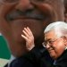 الرئيس الفلسطيني محمود عباس يلوح بيده خلال مراسم إحياء الذكرى الخامسة والخمسين لتأسيس حركة فتح في رام الله بالضفة الغربية عام 2019 (رويترز)