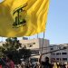 أنصار لـ«حزب الله» يلوّحون بأعلامه في الضاحية الجنوبية لبيروت (أ.ف.ب)